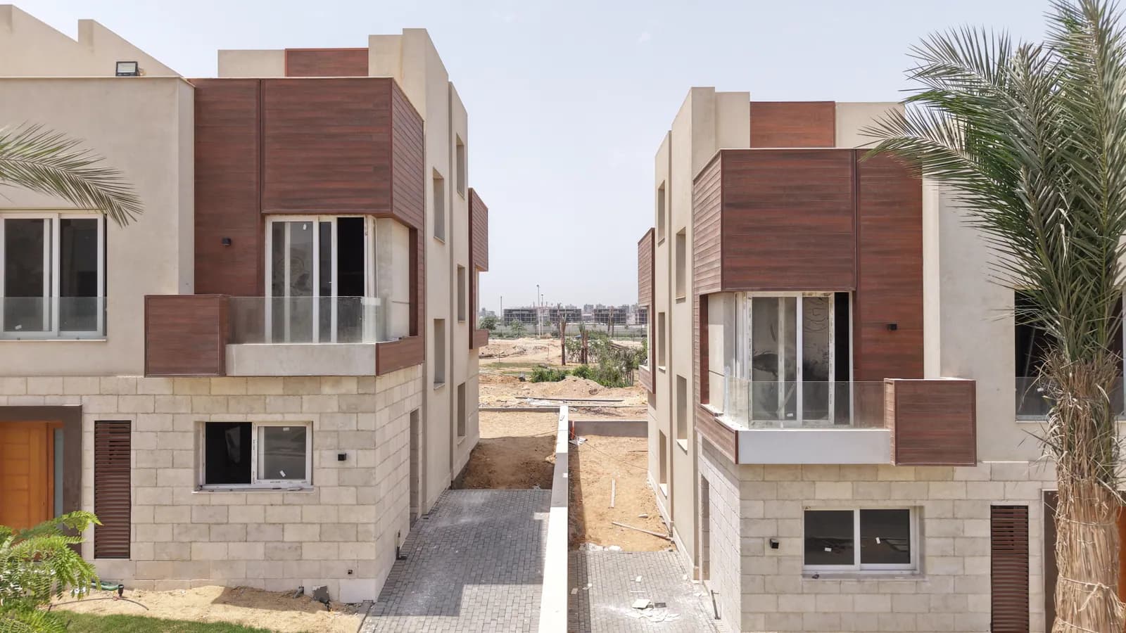 Modern stone-and-timber villa with white Premier windows — Azzar development