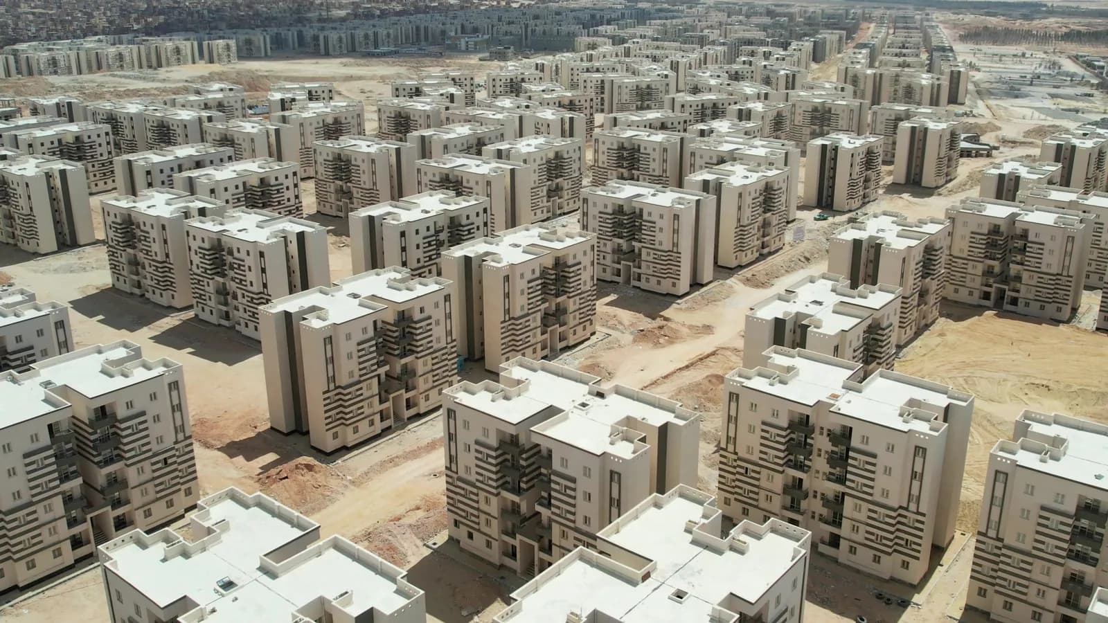 Aerial view of a large-scale national housing project — residential blocks to the horizon